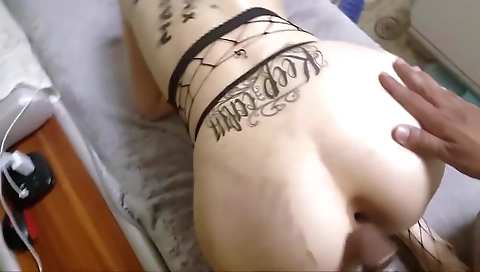 Asian milf with tattoo on her ass fucks her partner