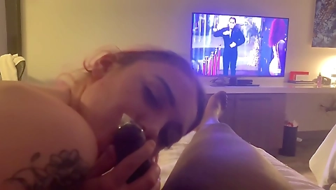 Redheaded tattooed teen is taking a cock deep in her mouth