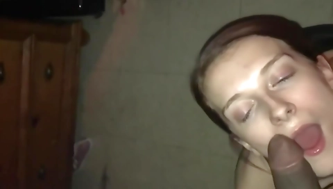 Sexy blonde with a big black cock is having a facial and a handjob